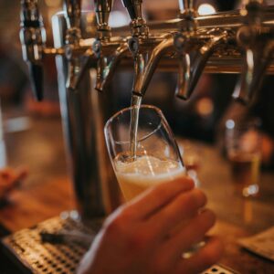A pint being poured in a pub