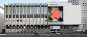 The old St Andrew's First Aid building. A Brutalist building with a big red cross on the right hand side of it