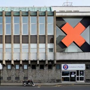 The old St Andrew's First Aid building. A Brutalist building with a big red cross on the right hand side of it