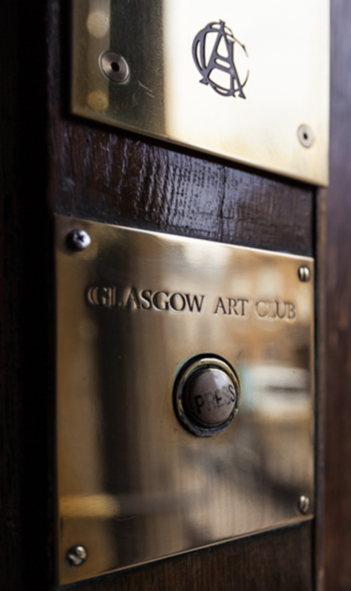 A gold door plate that says 'Glasgow Art Club'