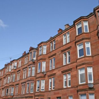 photograph of block of red sandstone tenements