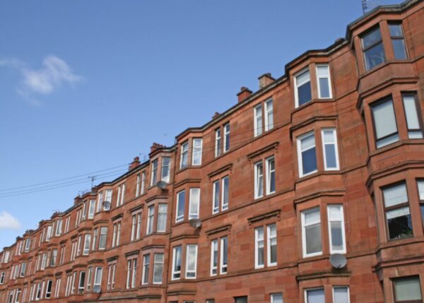 photograph of block of red sandstone tenements